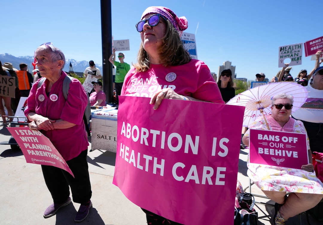 (Francisco Kjolseth | The Salt Lake Tribune) Marie Fulmer, Rachel Becker and Mary Phillips, from left, join protesters at the Utah Capitol for a “Bans Off Our Beehive” rally in support of abortion rights on Saturday, May 14, 2022.