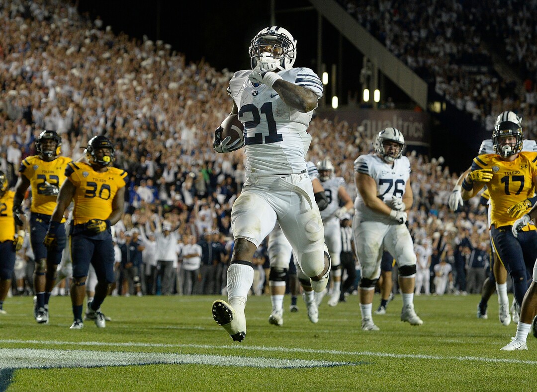 Scott Sommerdorf   |  The Salt Lake Tribune  BYU RB Jamaal Williams (21) scores his fifth TD on a 14 yard run to give BYU a 52-45 fourth quarter lead. BYU defeated Toledo 55-53, Friday, September 30, 2016. 