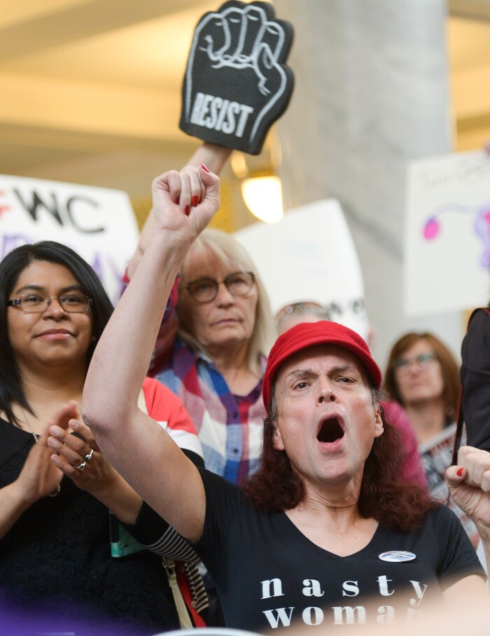 (Leah Hogsten | The Salt Lake Tribune) Rachel Edwards wearing a "Nasty Woman" shirt was joined by Vicki Voros who brought her "Resist" fist at Amplifying WomenÕs Voices rally to celebrate International WomenÕs Day at the Utah State Capitol Rotunda, hosted by KRCL, Thursday, March 8, 2018.