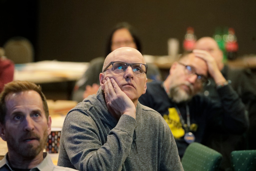 (Rick Bowmer | AP) In this Tuesday, Feb. 25, 2020, photo, people look on during a "Republicans in Utah supporting Pete Buttigieg" debate watch party, in Salt Lake City. Democratic presidential candidates like to boast about their ability to lure away disaffected Republican voters. If there’s a place to test their skills, it’s Utah.