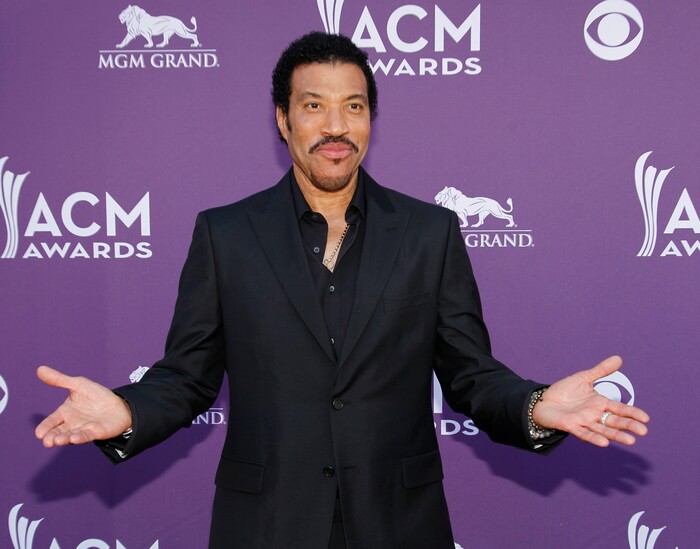 FILE - In this photo taken April 1, 2012, Lionel Richie arrives at the 47th Annual Academy of Country Music Awards in Las Vegas. The John F. Kennedy Center for the Performing Arts announced the recipients of the 2017 Kennedy Center Honors. They are: hip-hop artist LL Cool J, singers Gloria Estefan and Lionel Richie, television writer and producer Norman Lear and dancer Carmen de Lavallade. It’s the 40th year of the awards, which honor people who have influenced American culture through the arts. (AP Photo/Isaac Brekken, File)