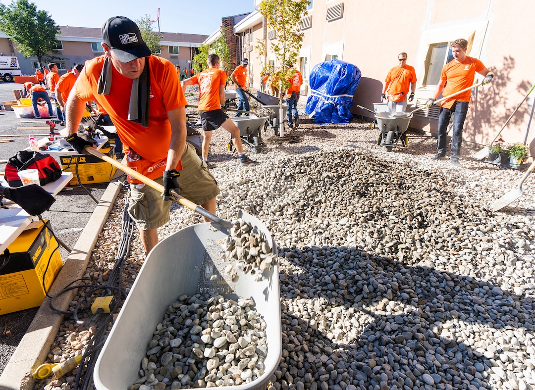 (Rick Egan | The Salt Lake Tribune) More than 600 volunteers, led by Home Depot employees, help spruce up the Sunrise Metro and Freedom Landing apartments in Salt Lake City on Wednesday, Sept. 21, 2022.