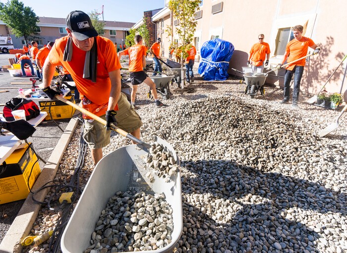 (Rick Egan | The Salt Lake Tribune) More than 600 volunteers, led by Home Depot employees, help spruce up the Sunrise Metro and Freedom Landing apartments in Salt Lake City on Wednesday, Sept. 21, 2022.
