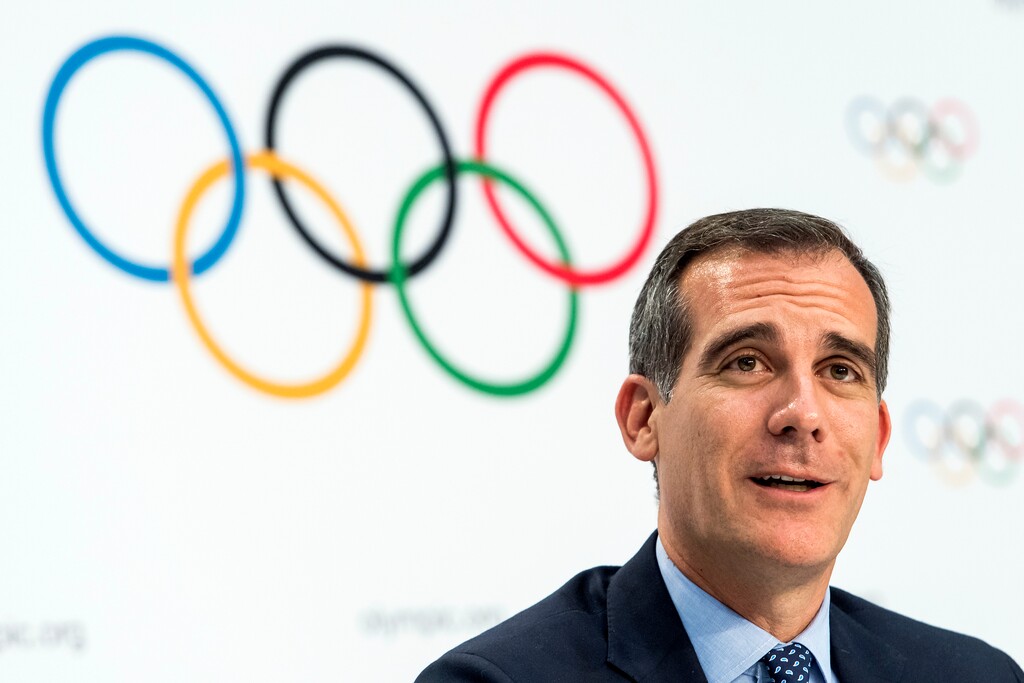 FILE - In this July 11, 2017 file photo Mayor of Los Angeles Eric Garcetti speaks, during a press conference after the International Olympic Committee (IOC) Extraordinary Session, at the SwissTech Convention Centre, in Lausanne, Switzerland. It was announced Monday, July 31, 2017 that Los Angeles has reached an agreement with international Olympic leaders that will open the way for the city to host the 2028 Summer Games, while ceding the 2024 Games to rival Paris. ﻿(Jean-Christophe Bott/Keystone via AP, File)