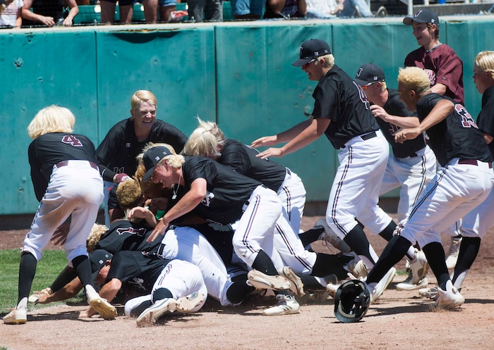 (Rick Egan  |  The Salt Lake Tribune)   Jordan High celebrates their 11-1 win over Olympus, for the 5A state baseball championship, at UVU in Orem, Friday, May 25, 2018.