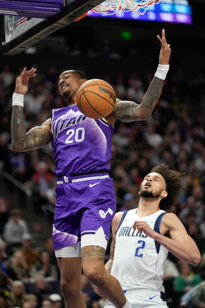 (Francisco Kjolseth  |  The Salt Lake Tribune) Utah Jazz forward John Collins (20) makes the dunk past Dallas Mavericks center Dereck Lively II (2) during an NBA basketball game Monday, March 25, 2024, in Salt Lake City.