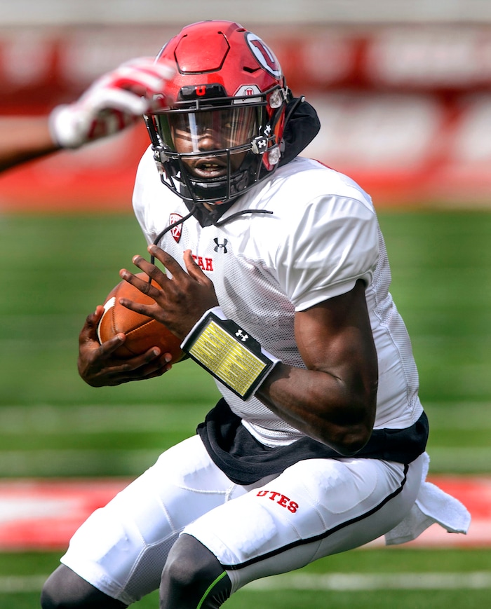 (Steve Griffin  |  The Salt Lake Tribune) Utah quarterback Tyler Huntley sruns the football during the University of Utah football team's first scrimmage at Rice-Eccles Stadium in Salt Lake City Friday March 30, 2018.