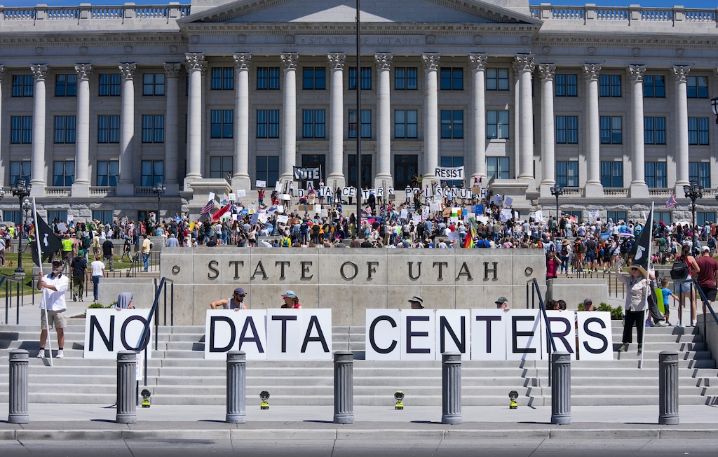 (Bethany Baker  |  The Salt Lake Tribune) People gather to voice opposition to a proposed data center campus in Box Elder County during a protest at the Utah Capitol in Salt Lake City on Saturday, May 23, 2026.
