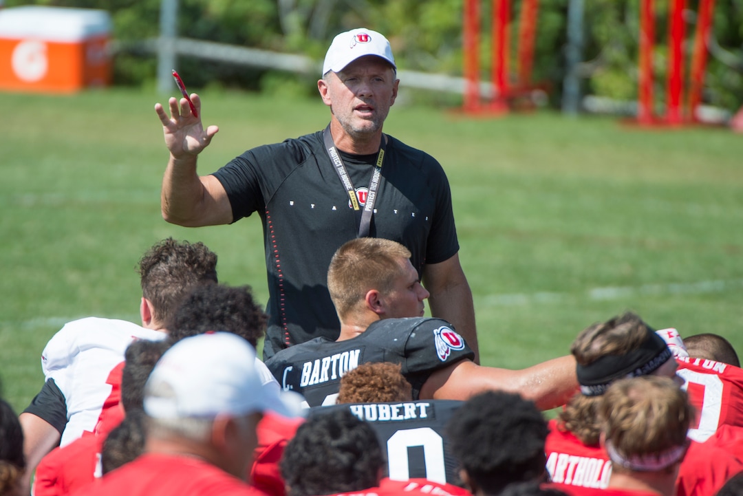 (Rick Egan  |  The Salt Lake Tribune)     Coach Kyle Whittingham talks to the team during practice.  Whittingham is entering his 14th year as Utah head coach, Wednesday, Aug. 15, 2018.