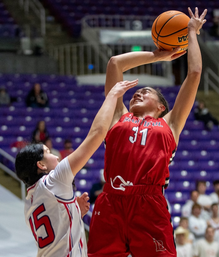 (Rick Egan | The Salt Lake Tribune) Bountiful Redhawks Milika Satuala shoots as Katie Durfey defends for the Red Devils, in the Girls 5A State Champions hip between the Springville Red Devils and the Bountiful Redhawks, at Weber State, on Saturday, March 4, 2023.
