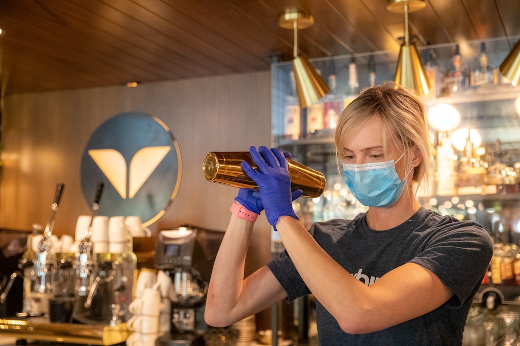 (Photo courtesy of Snowbird/Adam Barker Photography)  A bartender mixes a drink at Snowbird Ski resort.