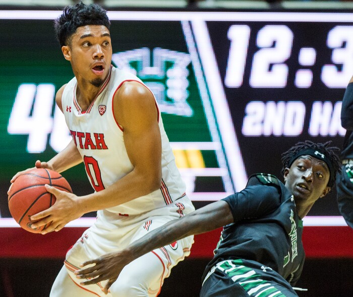 (Rick Egan  |  The Salt Lake Tribune)  Utah Utes guard Sedrick Barefield (0) tries to get the ball down court as Hawaii Warriors guard Sheriff Drammeh (23) defends, in basketball action, Utah Utes vs Hawaii Warriors, at the Jon M. Huntsman Center, Saturday, December 2, 2017.