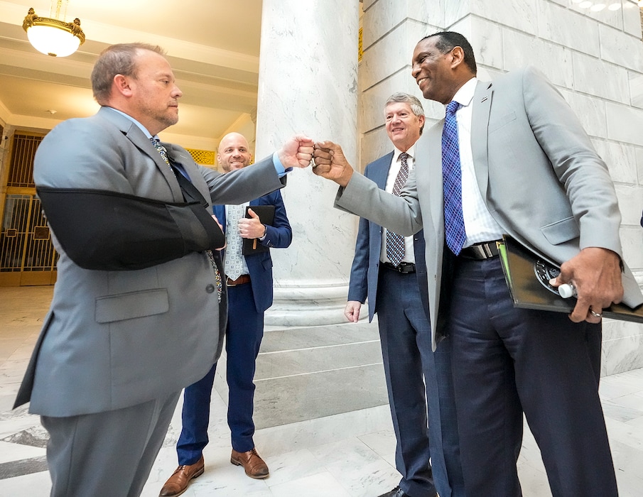 (Leah Hogsten | The Salt Lake Tribune)  U.S. Rep. Burgess Owens fist bumps lobbyist Jeff Hartley at the Capitol Tuesday, Jan. 25, 2022. Owens also met with House and Senate Republicans and Gov. Spencer Cox during the Legislative session.