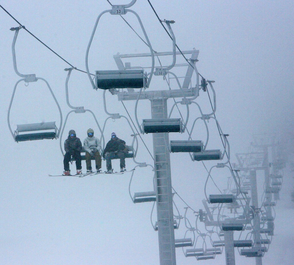 (Steve Griffin | The Salt Lake Tribune) Skiers brave fog and snow as they ride the ski lift during opening day at Eagle Point ski resort above Beaver in 2010. The resort announced Tuesday, March 12, 2024, that it is adopting a new policy of letting kids 12-under ski and snowboard for free.