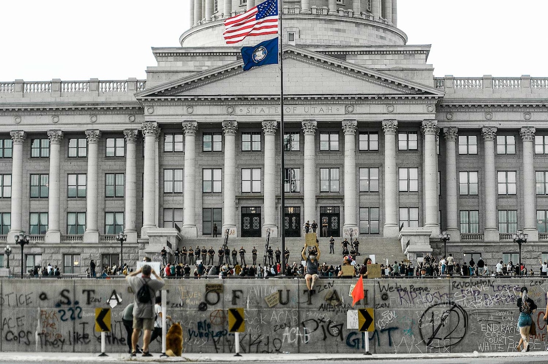 (Leah Hogsten  |  The Salt Lake Tribune)  The State Capitol as hundreds march in downtown Salt Lake City on Saturday, May 30, 2020.