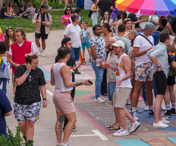 (Leah Hogsten | The Salt Lake Tribune)  Pride festival revelers enjoy the Utah Pride Festival at Washington Square, Saturday, June 4, 2022. 