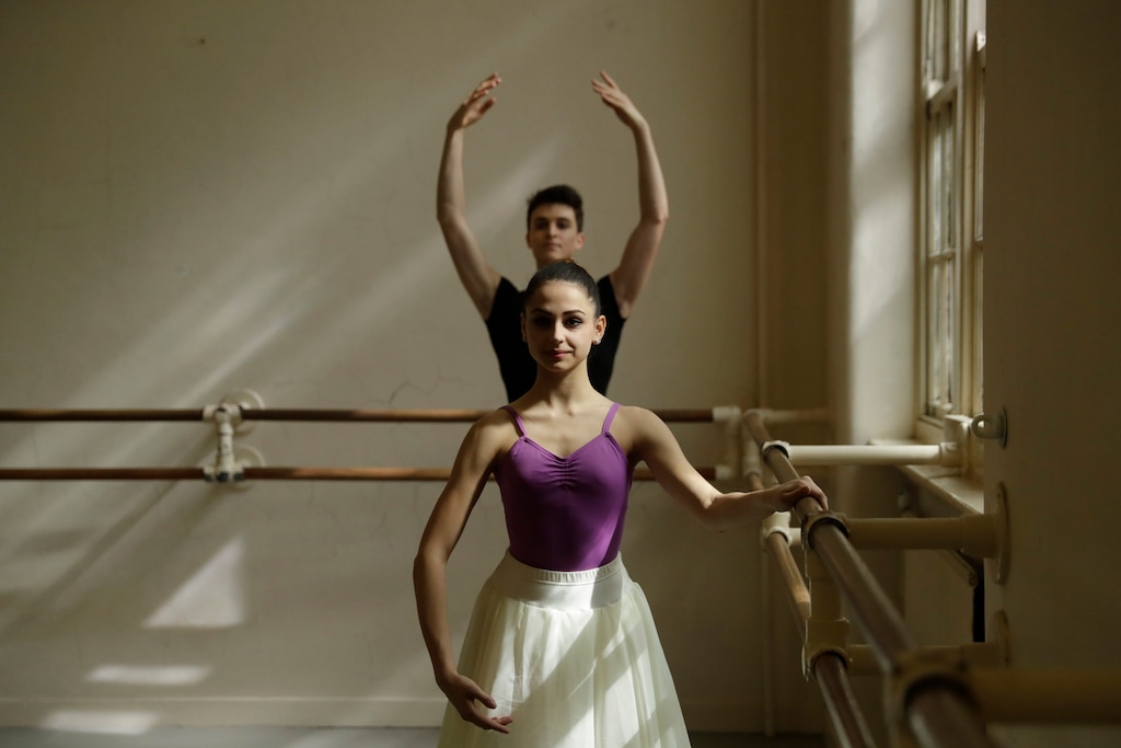 Italian students Rahien Testa, at back, aged 19 from Travedona-Monate, and Sara Delicati, aged 18 from Perugia, run through exercises as they pose for photographs in a studio at the Central School of Ballet in London, Tuesday, April 25, 2017. The full-time senior ballet school offers a three-year course for 16 to 19-year-olds from Britain and around the world, with students going on to have careers in classical ballet, contemporary dance and musical theatre. In the final year, students join the school's graduate touring company Ballet Central and work towards obtaining the BA (Hons) degree in Professional Dance and Performance. (AP Photo/Matt Dunham)