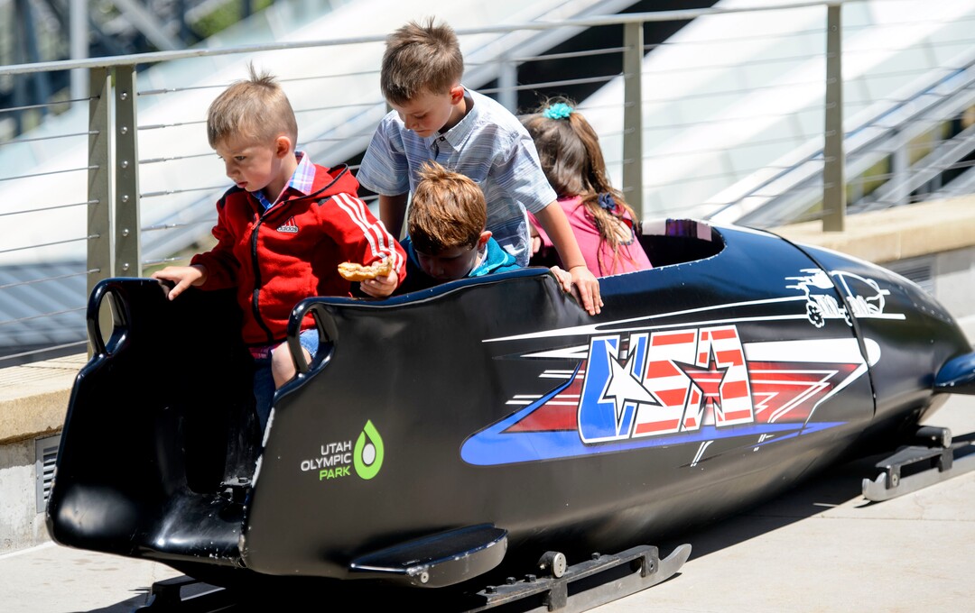 Steve Griffin  |  The Salt Lake TribuneChildren play in a bobsled as Park City and the Holcomb family and friends hold a memorial to honor Steve Holcomb the late 37-year-old Park City gold medalist bobsledder who passed away suddenly in Lake Placid last month. The remembrance was held in the summer pavilion at Utah Olympic Park Park City Saturday June 10, 2017.