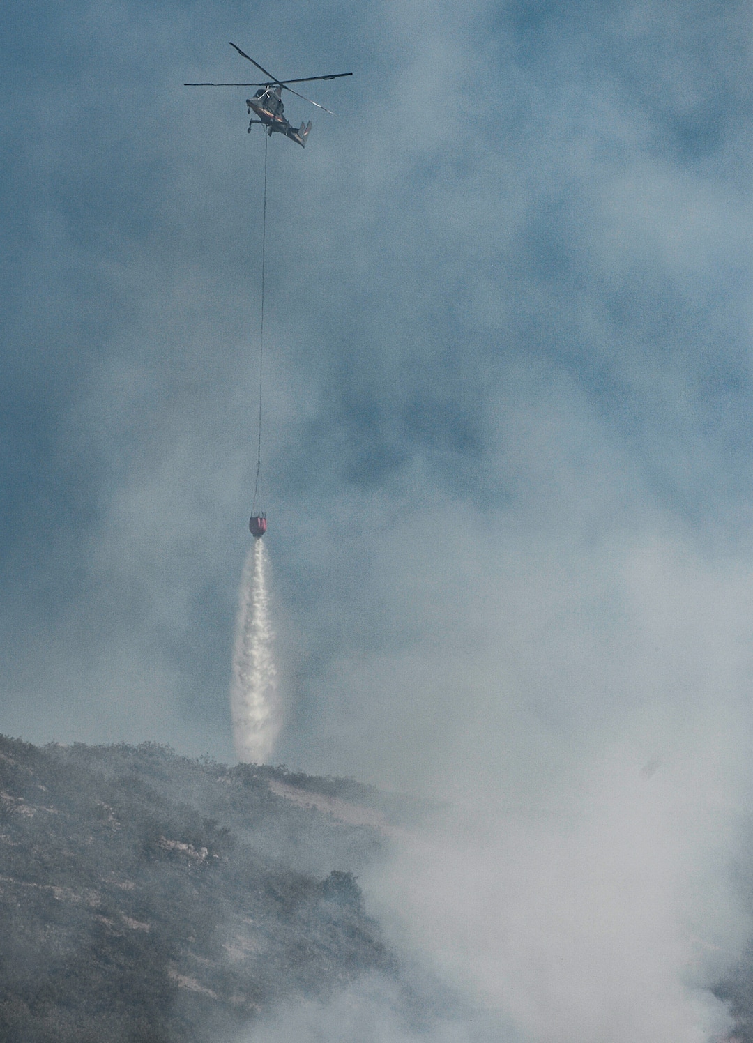 (Francisco Kjolseth  |  The Salt Lake Tribune)  Air crews battle the fire along the East Bountiful bench that grew to 150 acres early Friday morning, Aug. 30, 2019, and destroyed three homes. On Sept. 2, officials said the fire was 100% contained.
