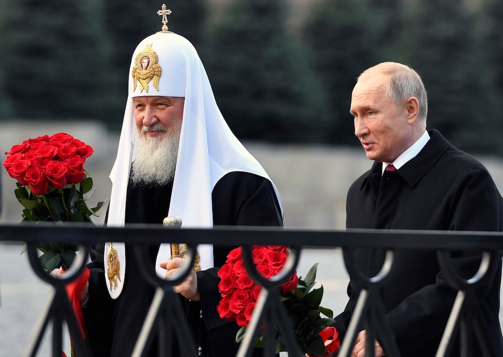 In this file photo from Nov. 4, 2018, Russian President Vladimir Putin and Russian Orthodox Church Patriarch Kirill, left, walk to lay flowers at the monument of Minin and Pozharsky at Red Square in Moscow, during National Unity Day. (Alexander Nemenov/Pool Photo via AP, File)