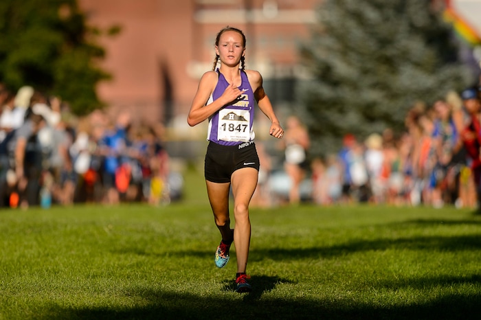 (Trent Nelson  |  The Salt Lake Tribune)  North Summit runner Sadie Sargent takes first in the Highland Invitational high school cross country meet in Salt Lake City Thursday August 17, 2017. Sargent is by far the fastest runner in Class 2A. She owns the 2A state record for fastest time at the state meet for a freshman, sophomore and junior, and she'll try to make it four for four later this year.