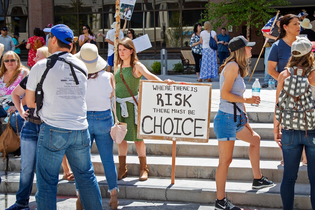 (Katherine Jones | Idaho Statesman via AP file photo)  More than 100 other people gather at City Hall to protest Mayor Lauren McLean's order mandating people to wear face coverings in Boise, Idaho, Friday, July 3, 2020.