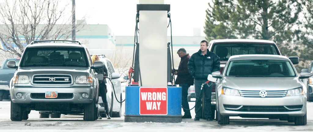 (Steve Griffin  |  Tribune file photo)

 Motorists fill up their cars at the Costco gas station in Salt Lake City, Dec. 28, 2015.