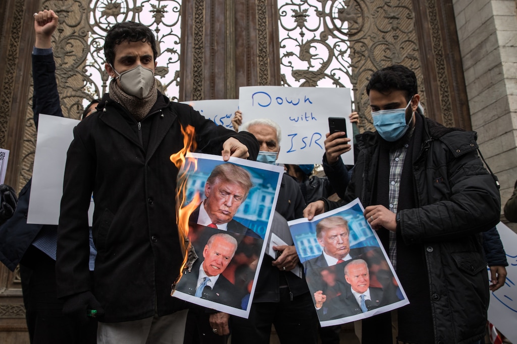 (Arash Khamooshi | New York Times file photo) Protestors in Tehran, Iran, burn photos of President Donald Trump and President-elect Joe Biden after Iran's leading nuclear scientist, Mohsen Fakhrizadeh, was assassinated, Nov 28. "Biden knows the region well, but if I had one piece of advice for him, it would be this: This is not the Middle East you left four years ago," writes New York Times columnist Thomas L. Friedman.