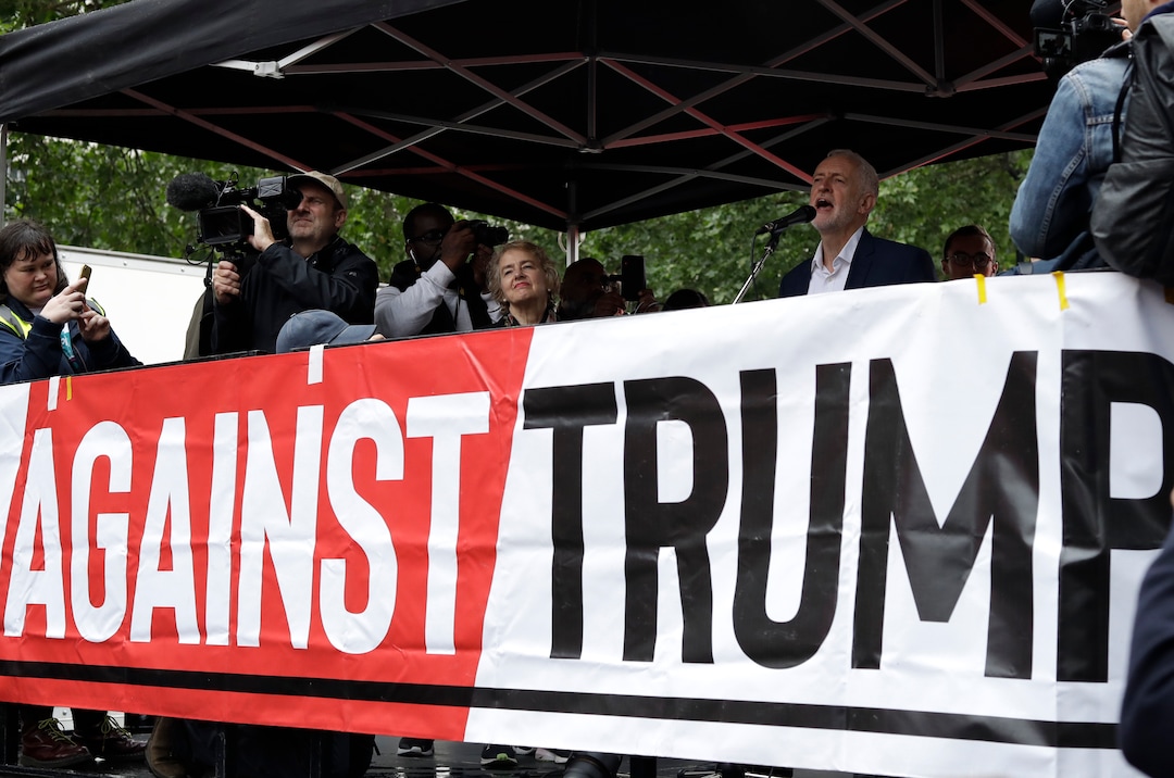 The leader of Britain's opposition Labour party Jeremy Corbyn makes a speech on stage during a rally, as people gathered on Whitehall in London, demonstrating against the state visit of President Donald Trump at an anti Donald Trump, Tuesday, June 4, 2019. Trump will turn from pageantry to policy Tuesday as he joins British Prime Minister Theresa May for a day of talks likely to highlight fresh uncertainty in the allies' storied relationship. (AP Photo/Matt Dunham)