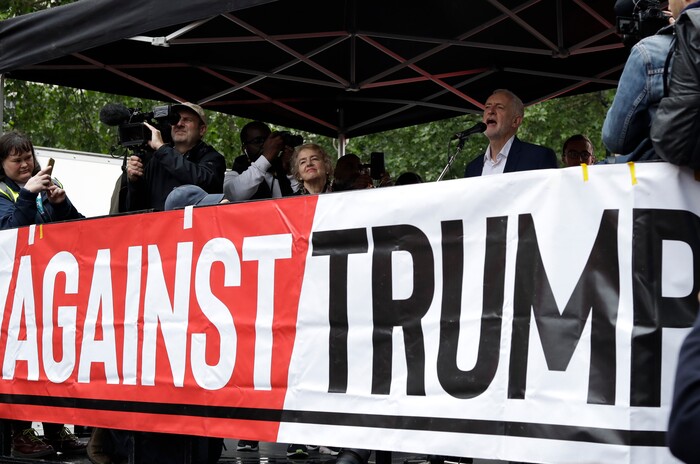 The leader of Britain's opposition Labour party Jeremy Corbyn makes a speech on stage during a rally, as people gathered on Whitehall in London, demonstrating against the state visit of President Donald Trump at an anti Donald Trump, Tuesday, June 4, 2019. Trump will turn from pageantry to policy Tuesday as he joins British Prime Minister Theresa May for a day of talks likely to highlight fresh uncertainty in the allies' storied relationship. (AP Photo/Matt Dunham)