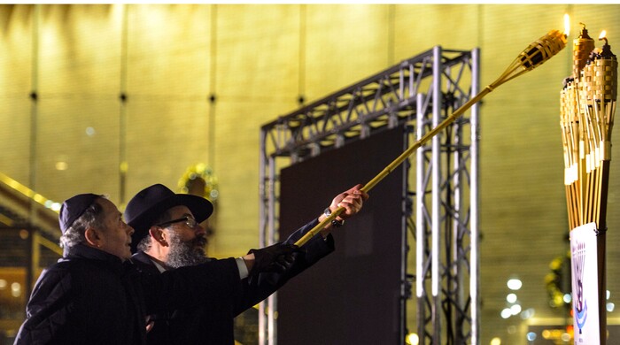 (Steve Griffin  |  The Salt Lake Tribune)   Rabbi Benny Zippel of Chabad Lubavitch is joined by John Price as they prepare to light a giant menorah for the first night of Hanukkah, the Jewish eight day festival of lights outside, Abravanel Hall in Salt Lake City Tuesday December 12, 2017.