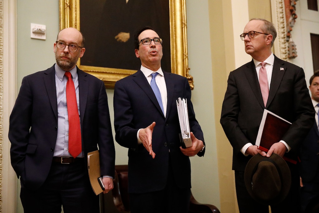 (Patrick Semansky | AP) Treasury Secretary Steve Mnuchin, center, speaks with members of the media as he departs a meeting with Senate Republicans on an economic lifeline for Americans affected by the coronavirus outbreak. on Capitol Hill in Washington, Monday, March 16, 2020.