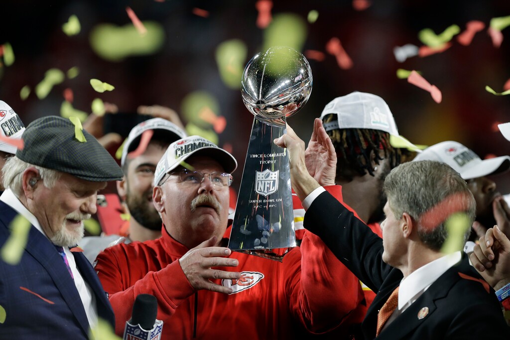 (Chris O'Meara | AP) Kansas City Chiefs chairman Clark Hunt, right, hands the trophy to head coach Andy Reid after the chiefs defeated the San Francisco 49ers in the NFL Super Bowl 54 football game Sunday, Feb. 2, 2020, in Miami Gardens, Fla.