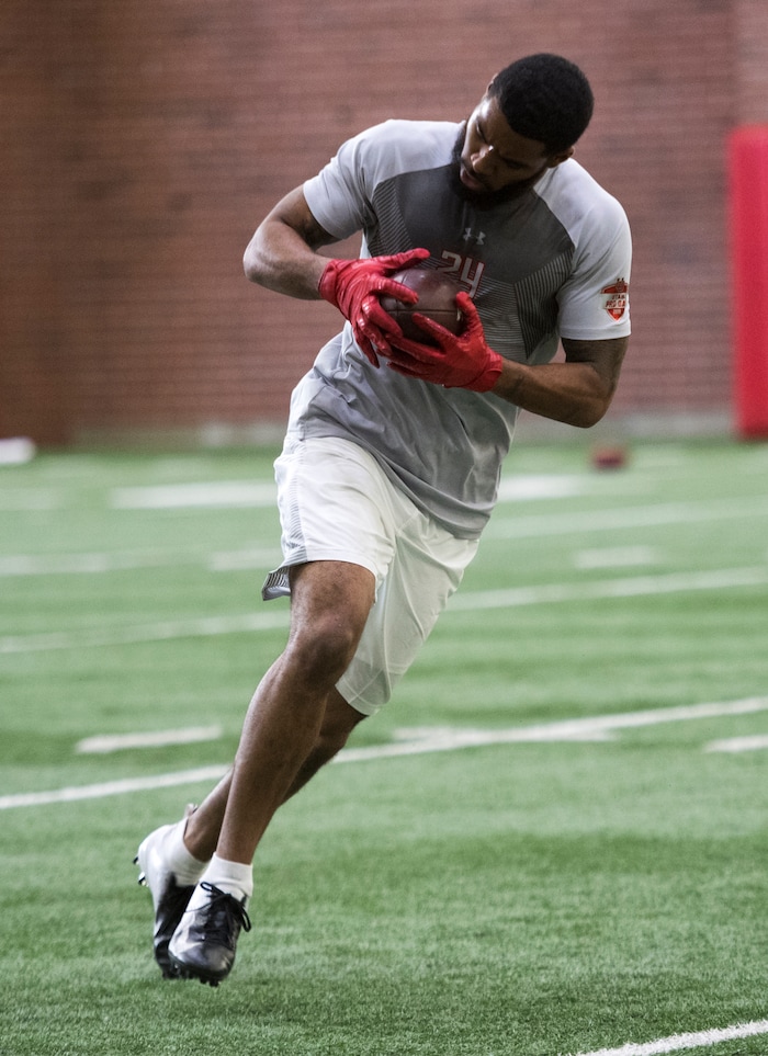 (Rick Egan  |  The Salt Lake Tribune)       Kenric Young, catches a pass during University of Utah's 2018 Pro Day for NFL scouts, at Spence Eccles Field House, Wednesday, March 28, 2018.
