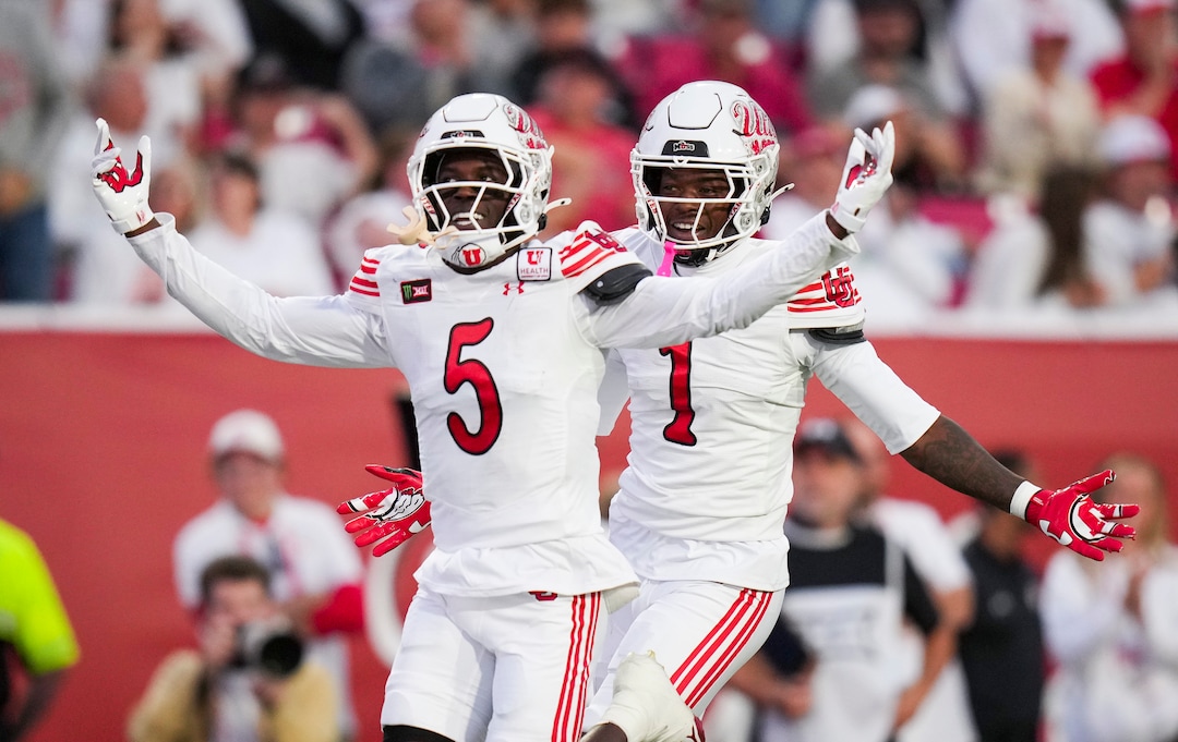 (Bethany Baker  |  The Salt Lake Tribune) Utah Utes cornerback James Chenault Jr. (5) reacts after intercepting the ball along with Utah Utes safety Rabbit Evans (1) during the game between the Utah Utes and the Kansas Jayhawks at Rice-Eccles Stadium in Salt Lake City on Saturday, Oct. 10, 2026.