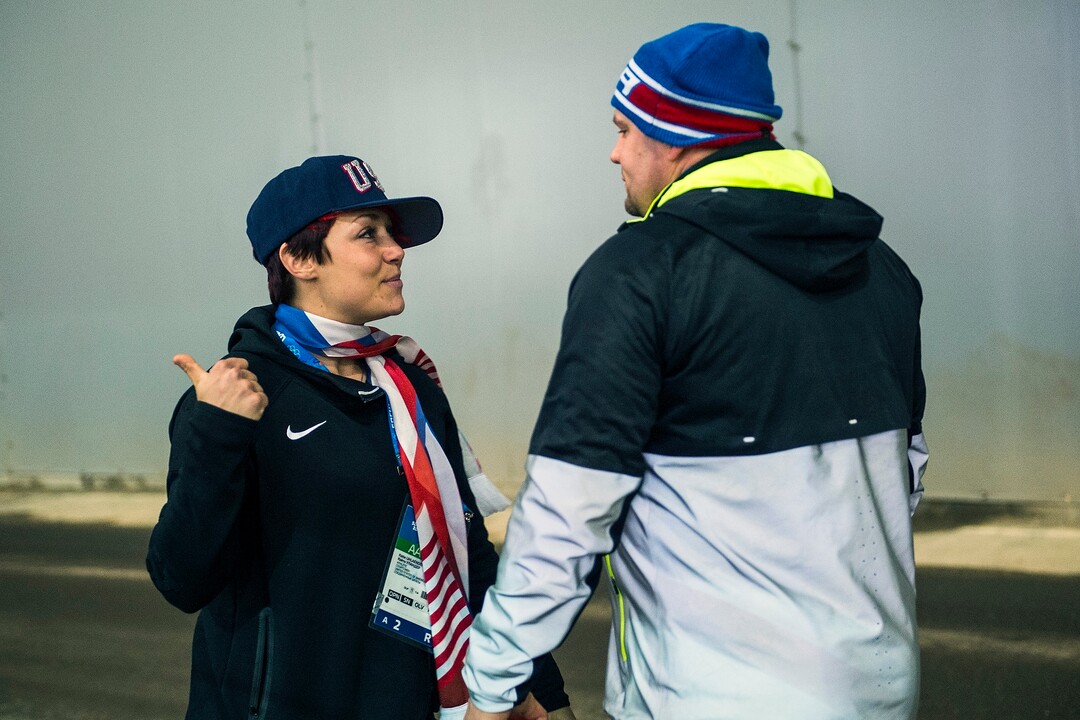 KRASNAYA POLYANA, RUSSIA  - JANUARY 22:Park City's Steven Holcomb talks with USA skeleton athlete Katie Uhlaender before his first run of the four-man bobsled at Sanki Sliding Center during the 2014 Sochi Olympics Saturday February 22, 2014. After the first run, they are in third place with a time of 54.89. (Photo by Chris Detrick/The Salt Lake Tribune)