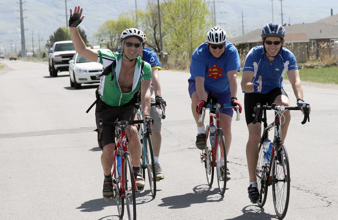 (Francisco Kjolseth  |  Tribune file photo)  Because the Utes won the 2010 BYU vs. U of U rivalry game, Provo Mayor  John Curtis, far right, and Salt Lake City Mayor Ralph Becker, left, pedal the approximately 50 miles from Provo to Salt Lake City in the third annual Rivalry Ride. After a brief ceremony at the Provo City Center at, 351 W. Center St., on Saturday May 7, 2011, the two accompanied by supporters headed out with a final destination in Salt Lake City at the City and County Building, 451 S. State St. Both mayors want to use the ride to acknowledge the success of last fall's BYU vs. U of U food drive and to encourage the public to participate in the upcoming Stamp Out Hunger food drive on May 14. Cans of food may be donated before and after the ride at the Provo City Center and Salt Lake City and County Building.