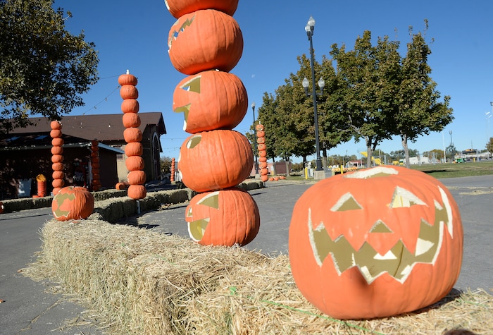 (Al Hartmann  |  The Salt Lake Tribune) 	Straw bales and pumpkins form a walkway at Salt Lake City’s new event, Pumpkin Nights, an outdoor, family-friendly Halloween walkthrough with ten immersive lands created with more than 3,000 hand-carved pumpkins. It will be open for 17 days—kicking off on Friday, Oct. 13 through Sunday, Oct. 29 at the Utah State Fairpark.