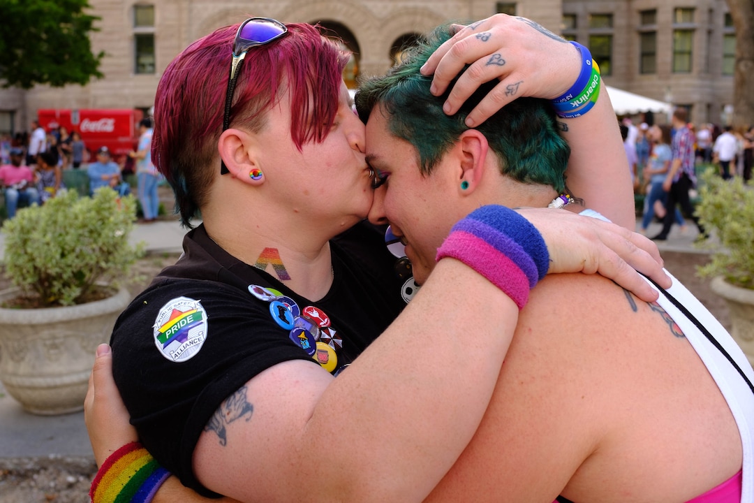 (Trent Nelson  |  The Salt Lake Tribune)Scha Strasburg and Karrah Watson embracing after getting engaged at the Utah Pride Festival in Salt Lake City on Saturday June 1, 2019.