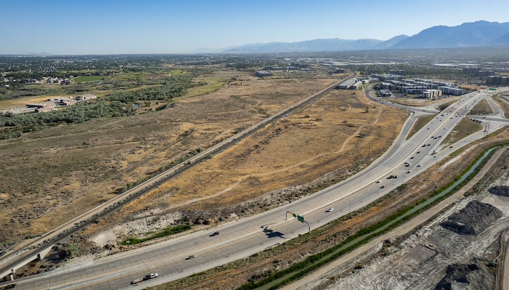 (Francisco Kjolseth | The Salt Lake Tribune) The Austin Townhomes, part of the Veranda West project in Draper, above right, are pictured on Wednesday, June 17, 2026. A new 8.8-acre surf park was recently approved by the Draper City Council in a decision to amend the master plan for the new development, set for the space between the FrontRunner tracks and Bangerter Highway west of I-15 in Draper.