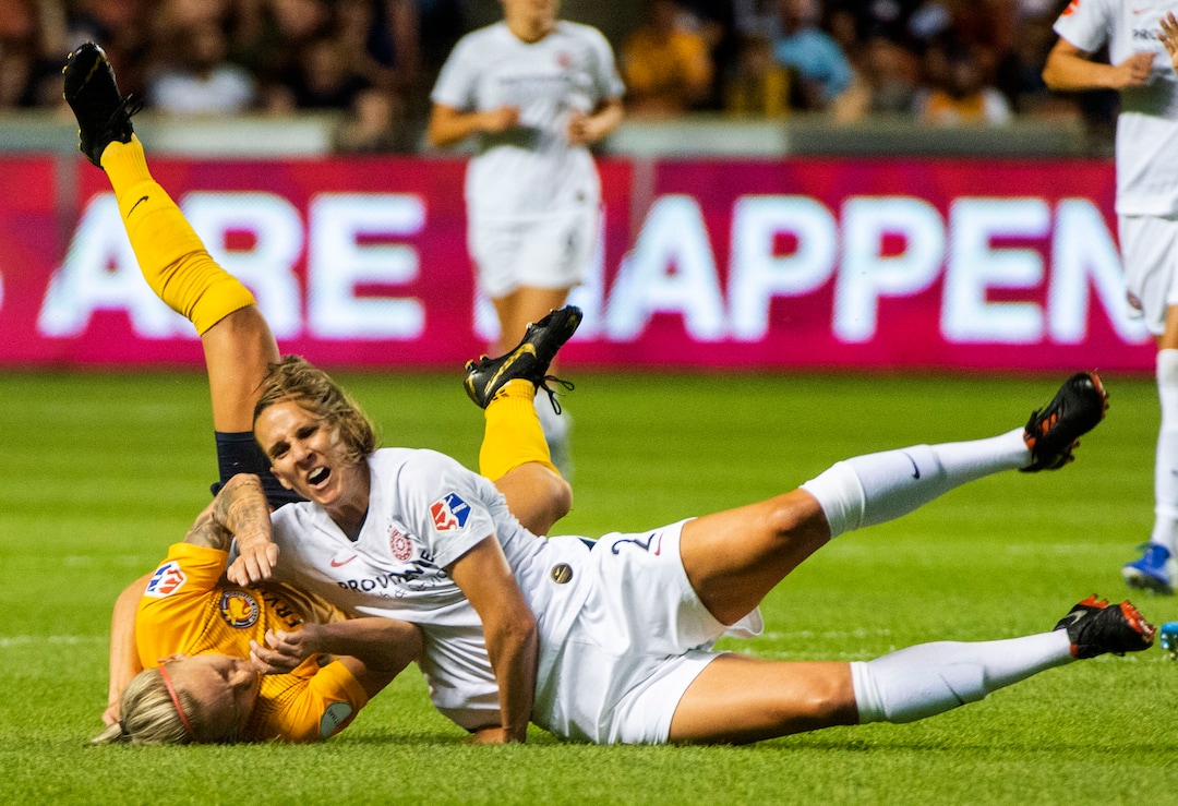(Rick Egan  |  The Salt Lake Tribune)    Utah Royals FC midfielder Gunnhildur Jónsdóttir (66) collides with Portland Thorns FC defender Katherine Reynolds (2), in Soccer action between Utah Royals FC and Portland Thorns FC, in Sandy, Friday, July 19, 2019.