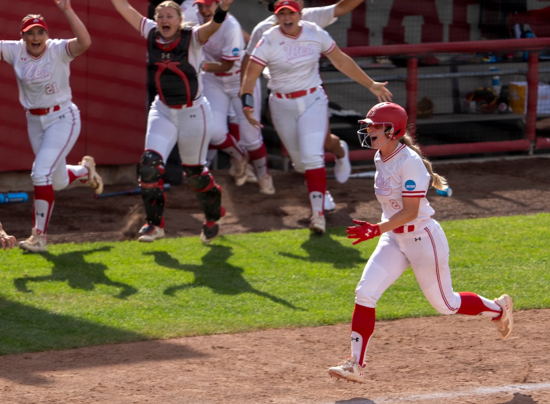 (Rick Egan | The Salt Lake Tribune)  Ellessa Bonstrom heads for home as the Utes leave the dug out to greet Julia Jimenez, after she hit a grand slam, giving Utah a 7-1 lead, in NCAA Softball Super Regionals action between the Utah Utes and the San Diego State Aztecs, on Saturday, May 27, 2023.