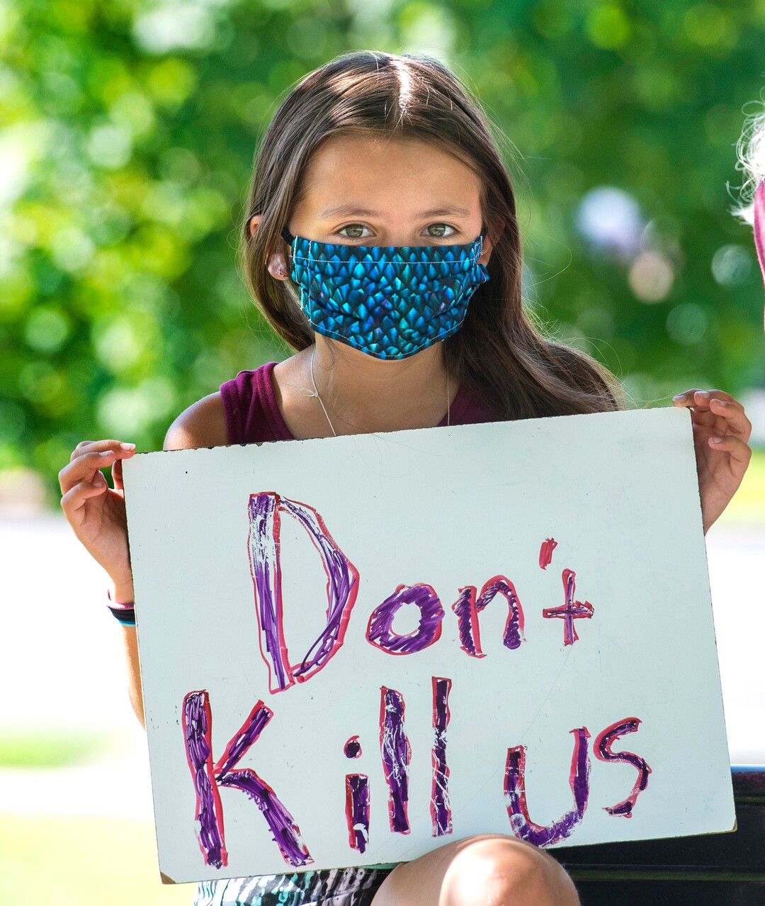 (Rick Egan  |  The Salt Lake Tribune)    Amelia McNamer made her own sign for the Mask-In and Car Caravan protest at the State Capitol to demand the Governor and other state and local leaders ensure that Utah school protect students and staff when schools reopen, on Thursday, July 23, 2020.