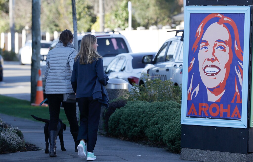 (Mark Baker | AP photo)
Pedestrians walk past a billboard featuring Prime Minister Jacinda Ardern with the word Aroha, meaning love, in Christchurch, New Zealand, Monday, June 8, 2020. New Zealand appears to have completely eradicated the coronavirus, at least for now, after health officials said Monday the last known infected person had recovered.