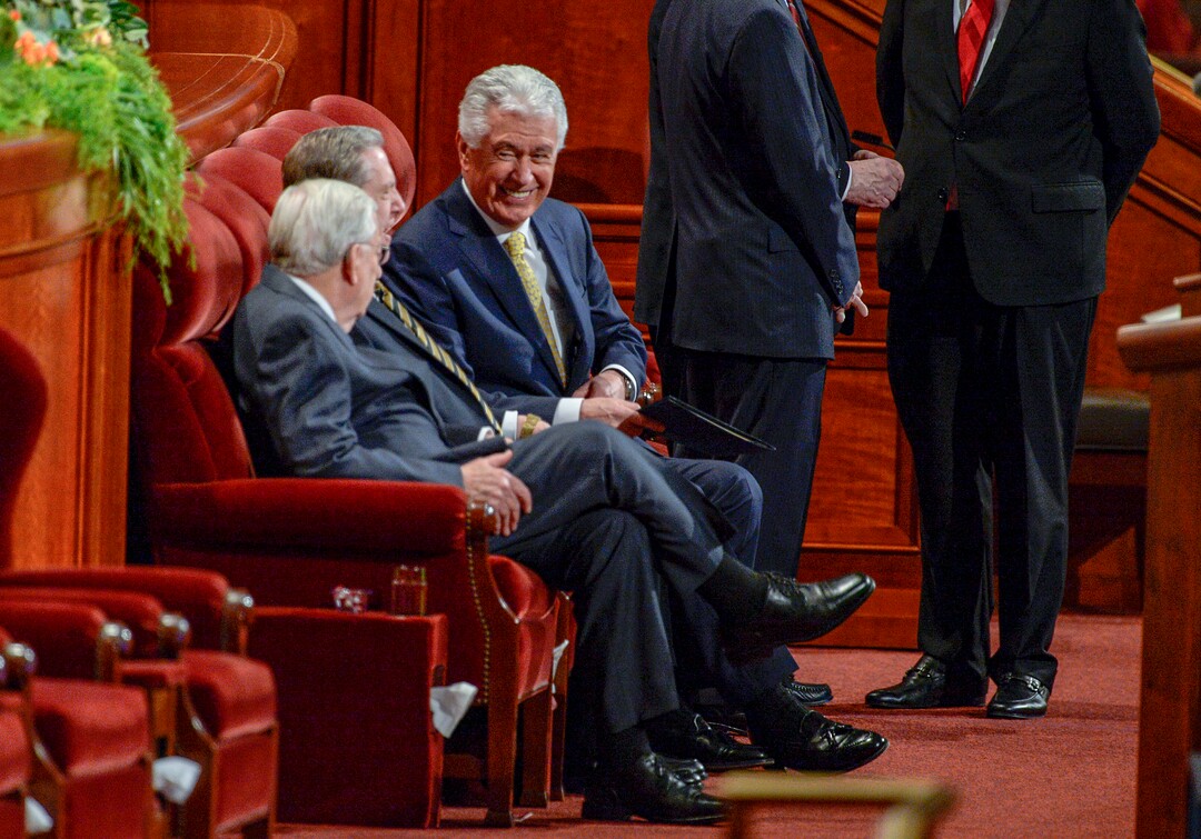 (Leah Hogsten  |  The Salt Lake Tribune) l-r President M. Russell Ballard, Elder Jeffrey R. Holland and Elder Dieter F. Uchtdorf greet one another during 189th Annual General Conference of The Church of Jesus Christ of Latter-day Saints in Salt Lake City.