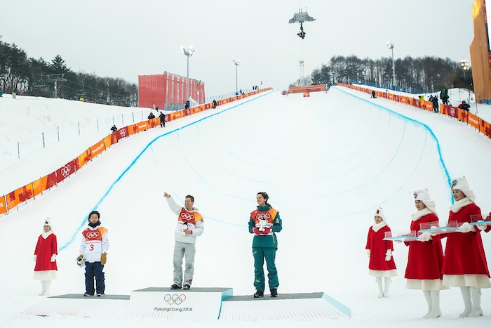 (Chris Detrick  |  The Salt Lake Tribune)  USA's Shaun White celebrates winning gold with Japan's Ayumu Hirano and Australia's Scotty James during the men's halfpipe finals at Phoenix Snow Park during the Pyeongchang 2018 Winter Olympics Wednesday, Feb. 14, 2018.  White won the event with a 97.75, his third Olympic gold medal in the halfpipe (2006, 2010, 2018).
