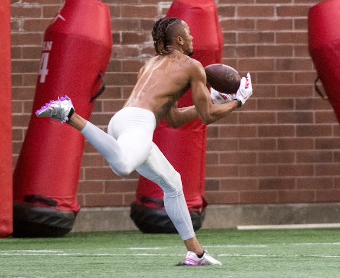 (Rick Egan  |  The Salt Lake Tribune)      Darren Carrington II,  catches a pass from Troy Williams during University of Utah's 2018 Pro Day for NFL scouts, at Spence Eccles Field House, Wednesday, March 28, 2018.