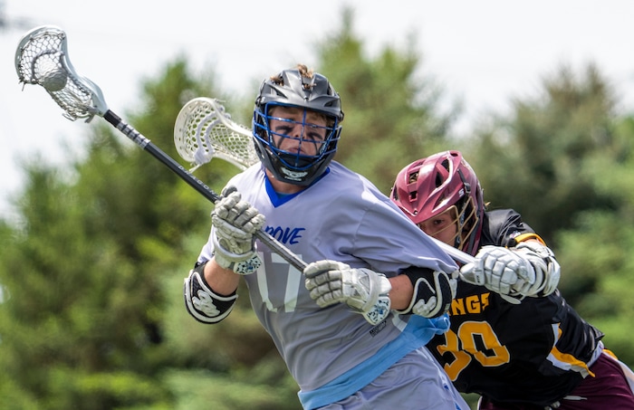 (Rick Egan | The Salt Lake Tribune) Mason Hepworth (30) Viewmont, makes contact with Evan Robinson (17) Pleasant Grove, in the Division C championship game between the Viewmont Vikings and the Pleasant Grove Vikings, in Layton, on Saturday, May 29, 2021.