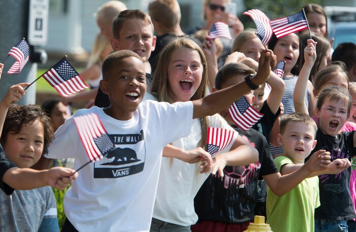 (Rick Egan  |  The Salt Lake Tribune)  Kids cheer on the racers on Gentile Street in Layton, in the Tour of Utah stage 5, Friday, August 4, 2017.


