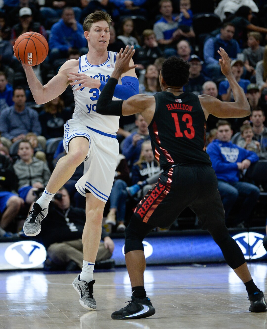 (Francisco Kjolseth  |  The Salt Lake Tribune)  Brigham Young Cougars forward Dalton Nixon (33) throws a pass over UNLV Rebels guard Bryce Hamilton (13) as BYU takes on UNLV in men's NCAA basketball at Vivint Smart Home Arena in Salt Lake City on Sat. Dec. 7, 2019.